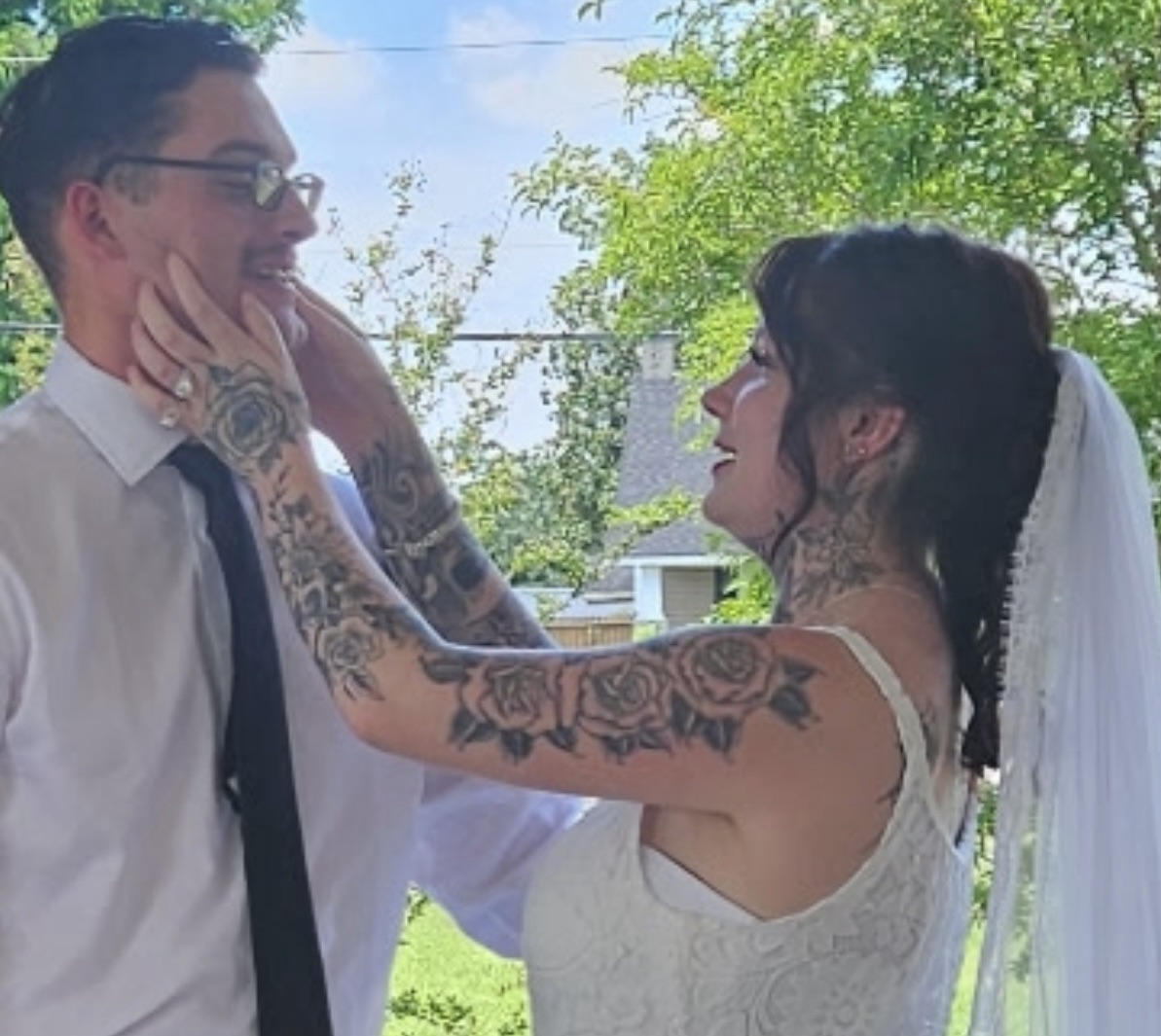 An outdoor wedding in town draws attention.